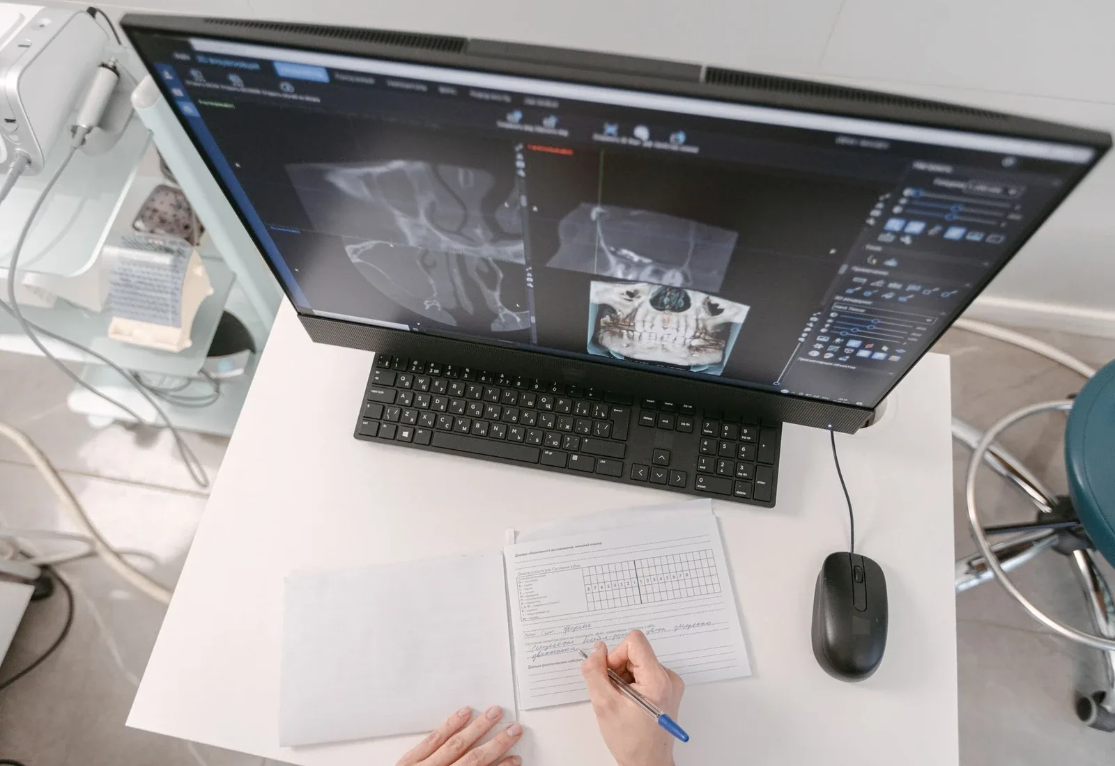 Healthcare coding professional reviewing medical documentation at a computer