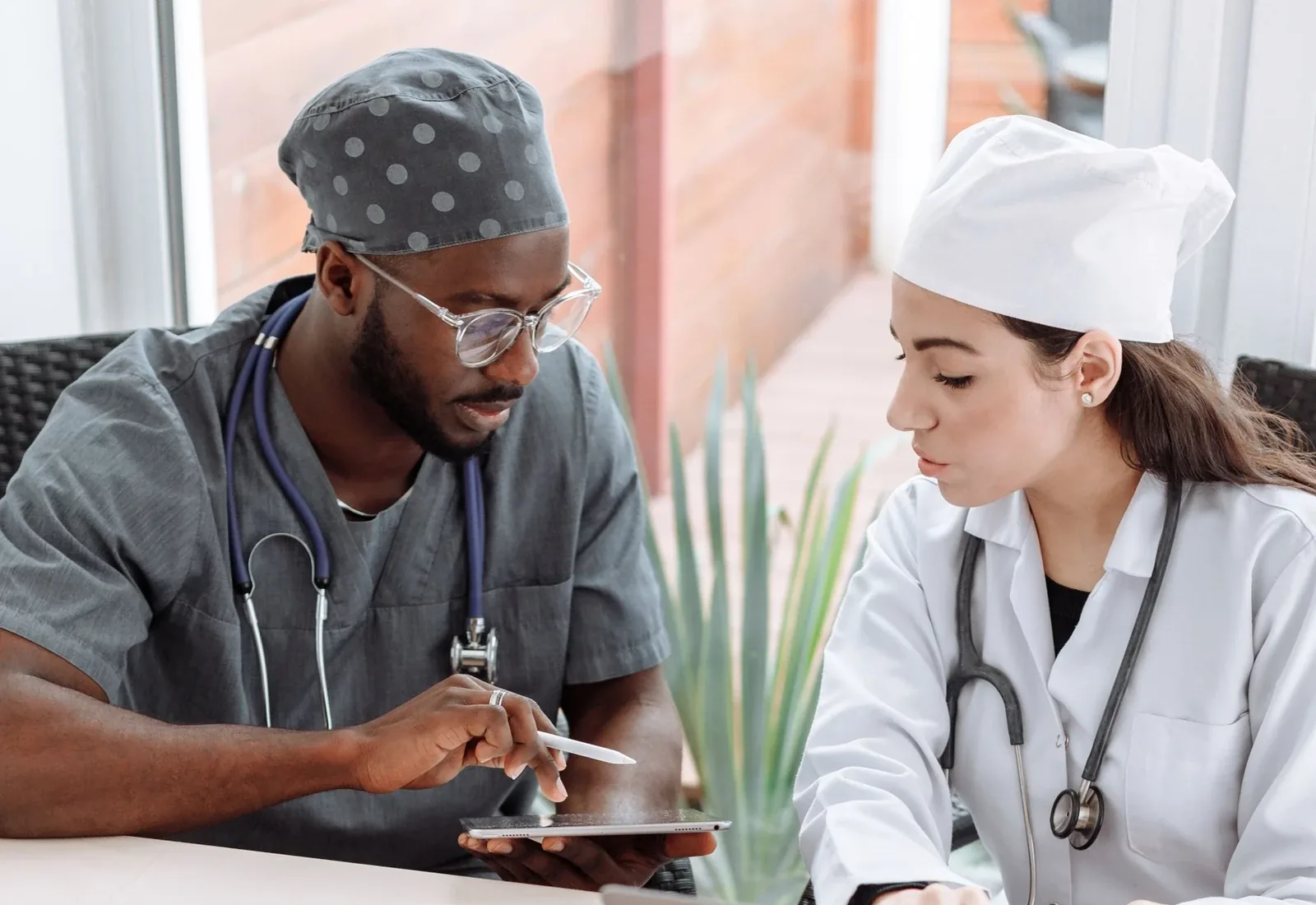 Healthcare professionals discussing documentation and coding review requirements